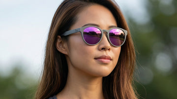 Asian outdoor athlete wearing 2nu sunglasses in bright daylight for a UV400 protection guide