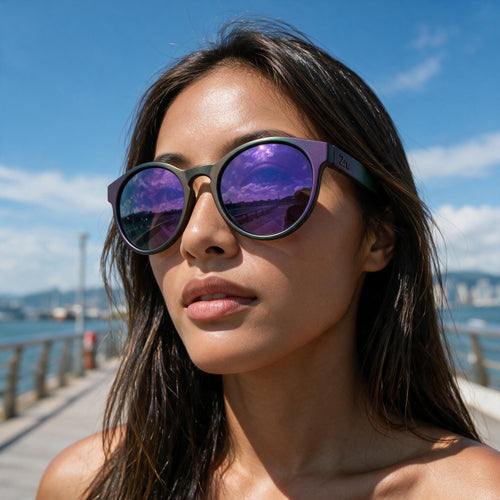 Woman wearing Halo sunglasses with a hand-sprayed Purple Green frame and Purple Green Hexachroma lenses