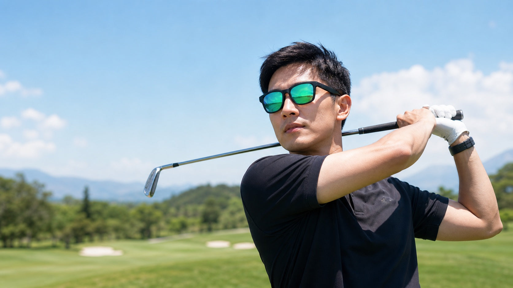 East Asian golfer wearing black 2nu sunglasses with green mirrored lenses for the Fishing and Golf sunglasses guide.